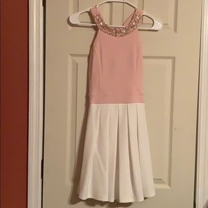Pink/white dress with gem neckline and bow back.